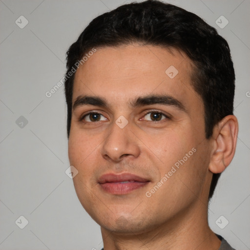 Joyful white young-adult male with short  black hair and brown eyes