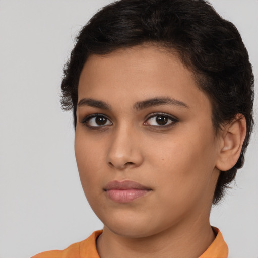 Neutral latino young-adult female with medium  brown hair and brown eyes