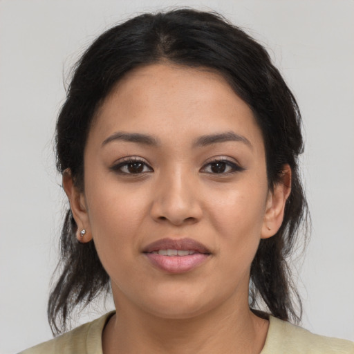 Joyful latino young-adult female with medium  black hair and brown eyes