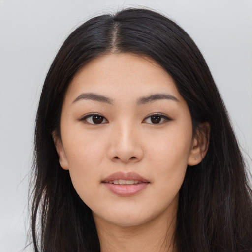 Joyful asian young-adult female with long  black hair and brown eyes