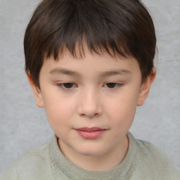 Joyful white child male with short  brown hair and brown eyes