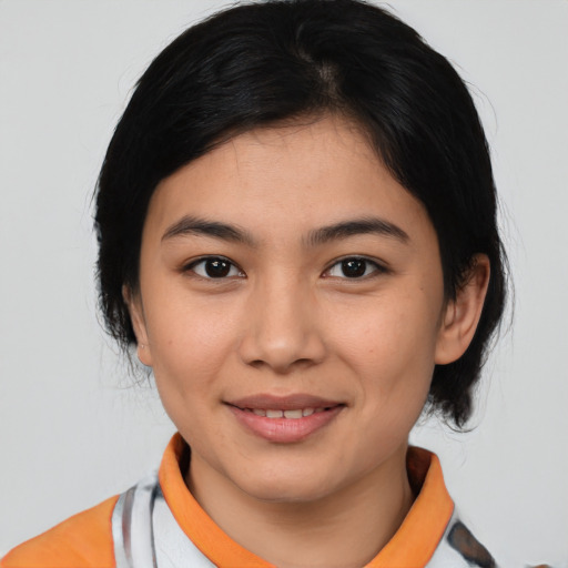 Joyful latino young-adult female with medium  black hair and brown eyes