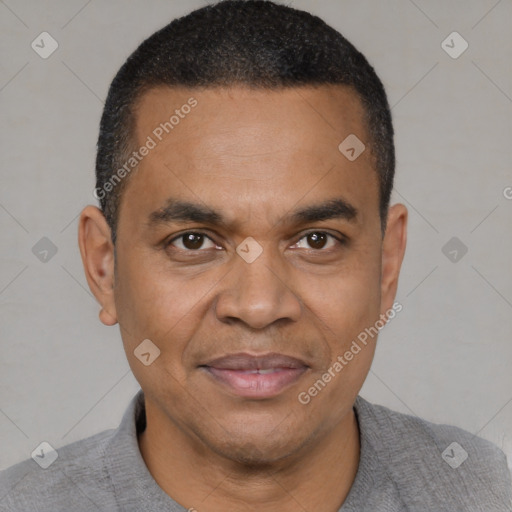 Joyful latino adult male with short  black hair and brown eyes