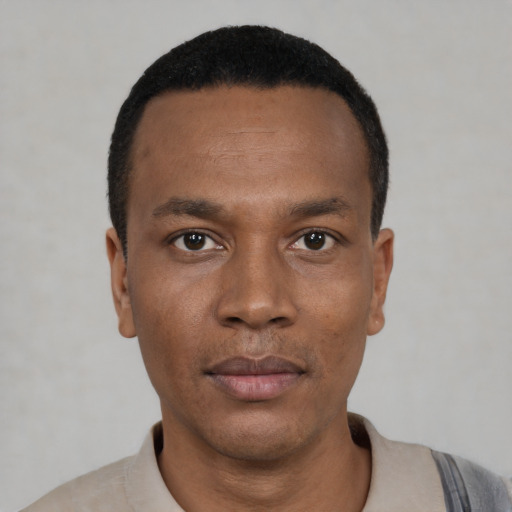 Neutral black young-adult male with short  black hair and brown eyes