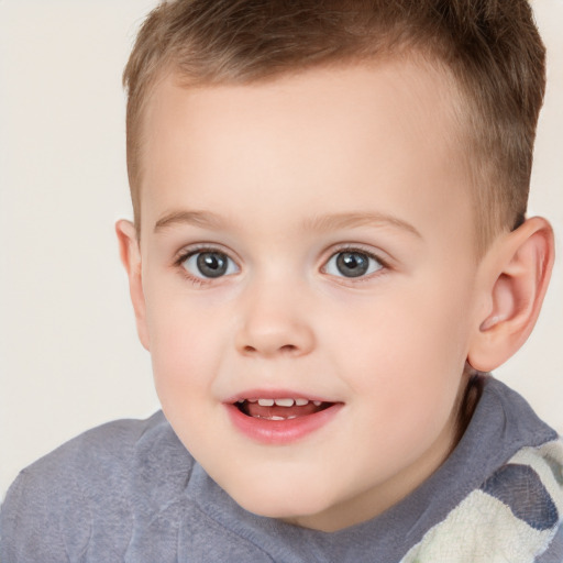 Joyful white child male with short  brown hair and brown eyes