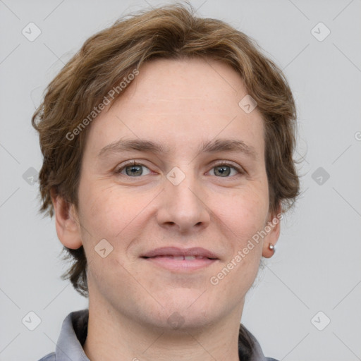 Joyful white adult male with short  brown hair and grey eyes