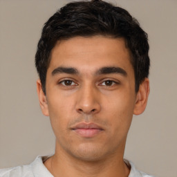 Neutral latino young-adult male with short  black hair and brown eyes