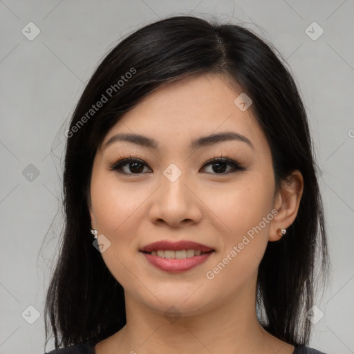 Joyful asian young-adult female with medium  black hair and brown eyes