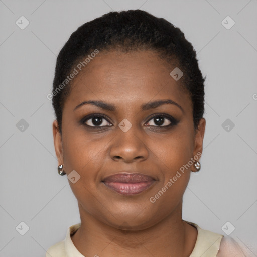 Joyful black young-adult female with short  brown hair and brown eyes