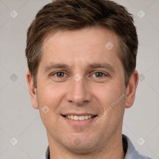 Joyful white adult male with short  brown hair and brown eyes