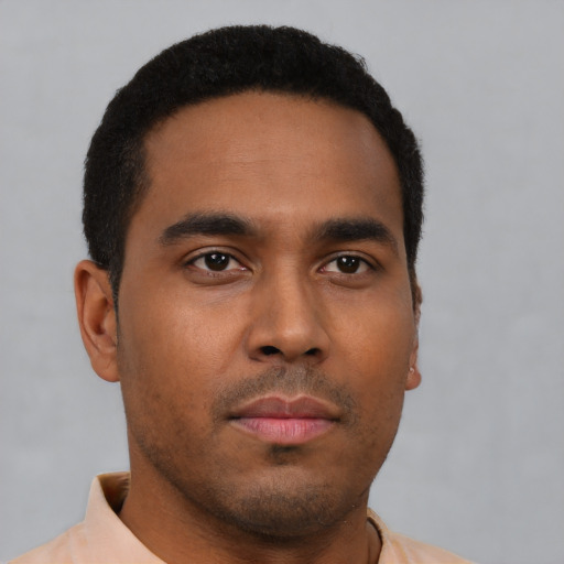 Neutral latino young-adult male with short  brown hair and brown eyes