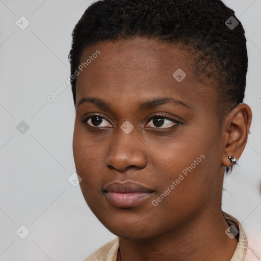 Joyful black young-adult female with short  brown hair and brown eyes