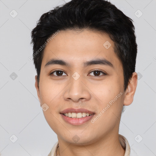 Joyful asian young-adult male with short  black hair and brown eyes