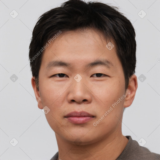 Neutral asian young-adult male with short  brown hair and brown eyes