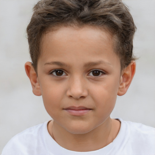 Joyful white child male with short  brown hair and brown eyes