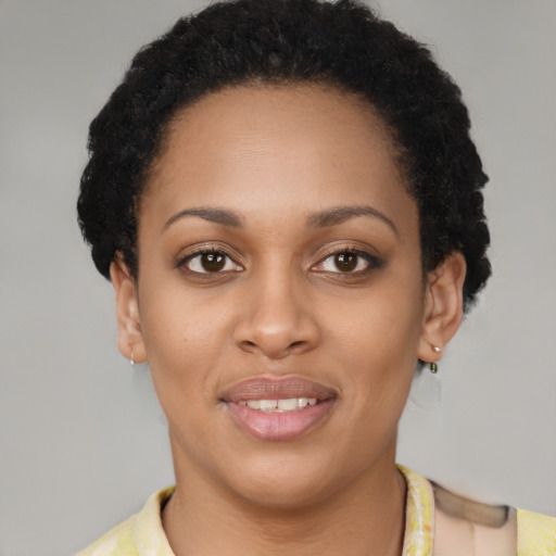 Joyful latino young-adult female with short  brown hair and brown eyes