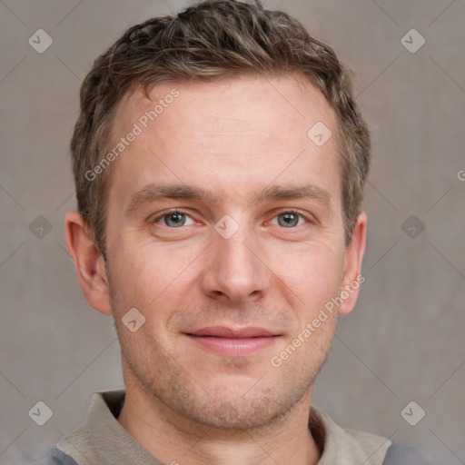 Joyful white adult male with short  brown hair and grey eyes