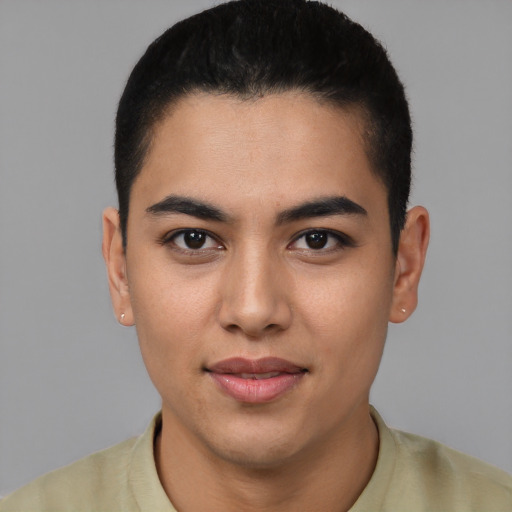 Joyful latino young-adult male with short  black hair and brown eyes