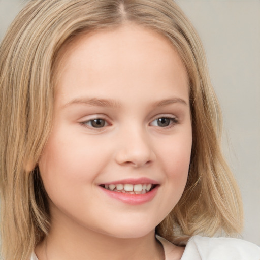 Joyful white child female with medium  brown hair and brown eyes