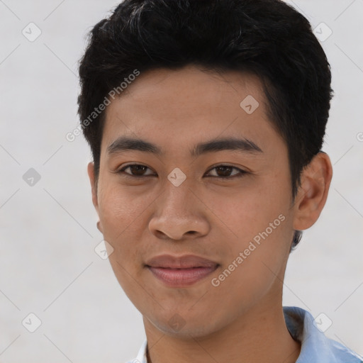 Joyful asian young-adult male with short  black hair and brown eyes