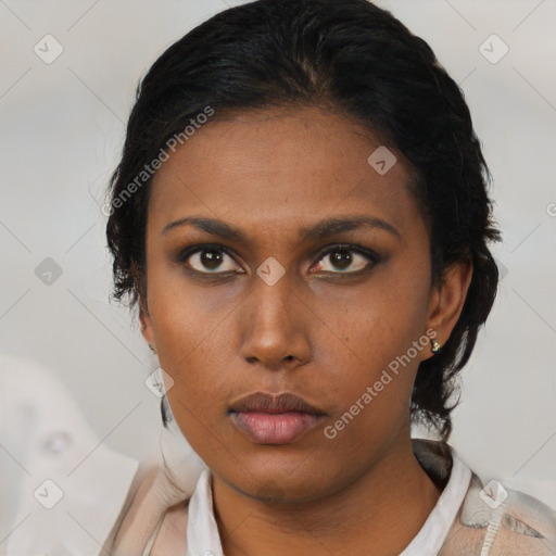 Neutral black young-adult female with medium  brown hair and brown eyes