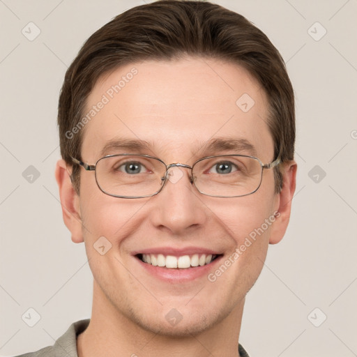 Joyful white adult male with short  brown hair and grey eyes