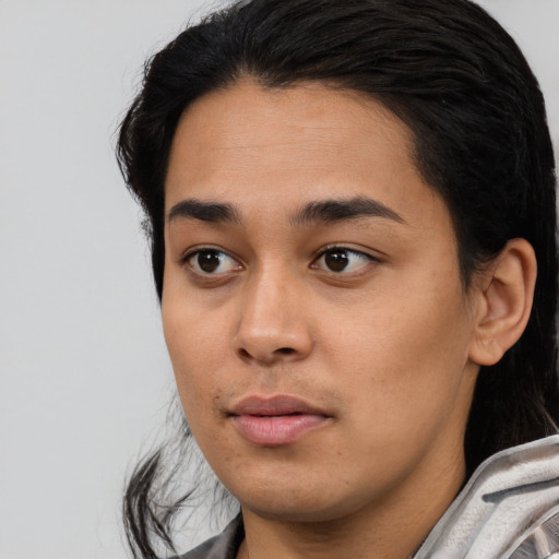 Joyful white young-adult female with medium  black hair and brown eyes
