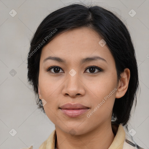 Joyful asian young-adult female with medium  black hair and brown eyes