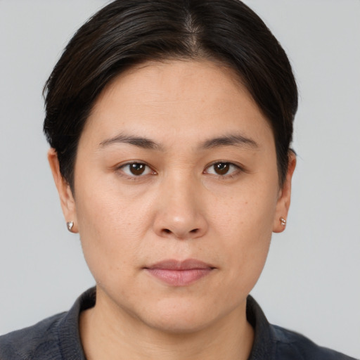 Neutral white young-adult female with short  brown hair and brown eyes