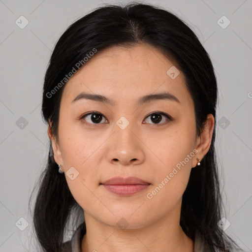 Joyful asian young-adult female with medium  black hair and brown eyes