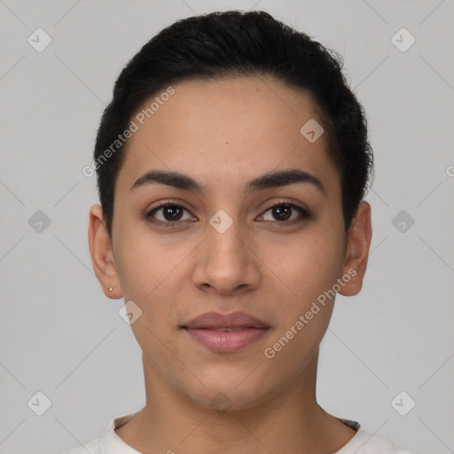 Joyful latino young-adult female with short  black hair and brown eyes