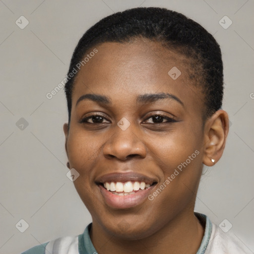 Joyful black young-adult female with short  black hair and brown eyes