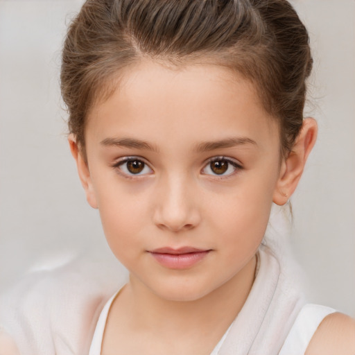 Joyful white child female with short  brown hair and brown eyes