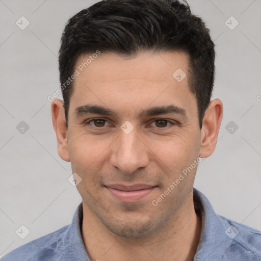 Joyful white young-adult male with short  black hair and brown eyes