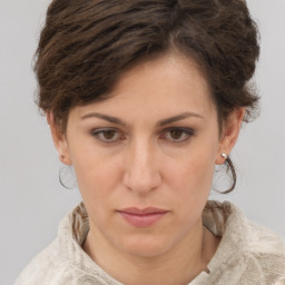 Neutral white young-adult female with short  brown hair and brown eyes