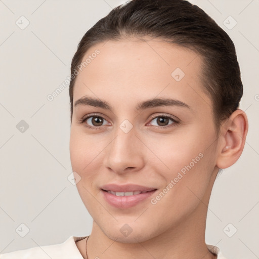 Joyful white young-adult female with short  brown hair and brown eyes