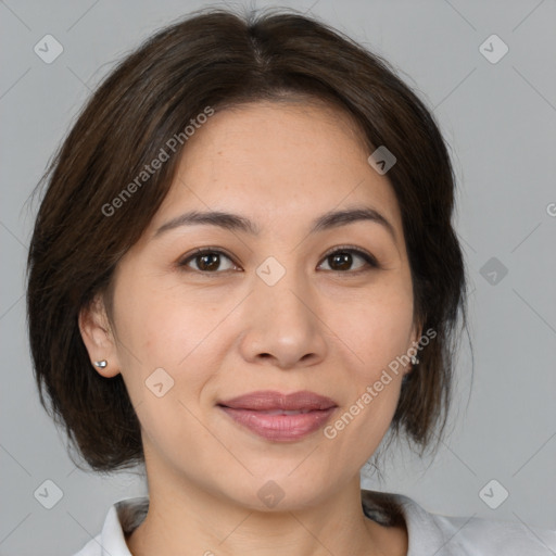 Joyful white adult female with medium  brown hair and brown eyes