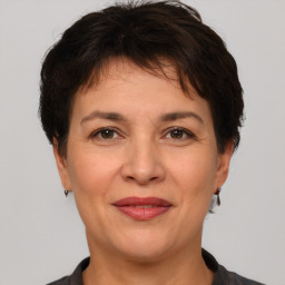 Joyful white adult female with short  brown hair and brown eyes