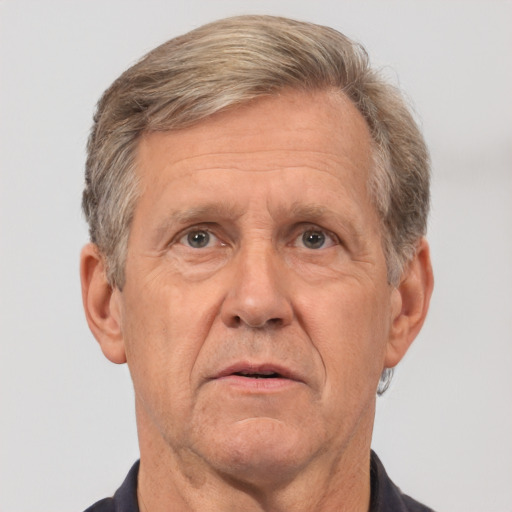 Neutral white middle-aged male with short  gray hair and brown eyes