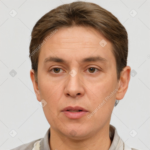 Neutral white adult male with short  brown hair and grey eyes