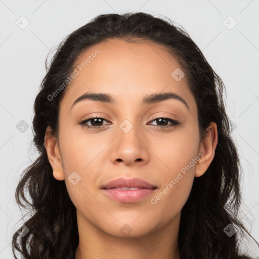 Joyful latino young-adult female with long  brown hair and brown eyes