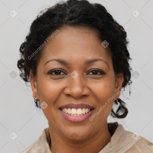 Joyful black adult female with short  brown hair and brown eyes