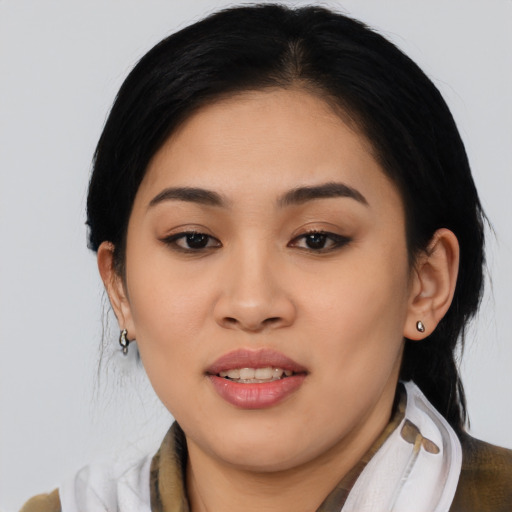 Joyful asian young-adult female with medium  black hair and brown eyes