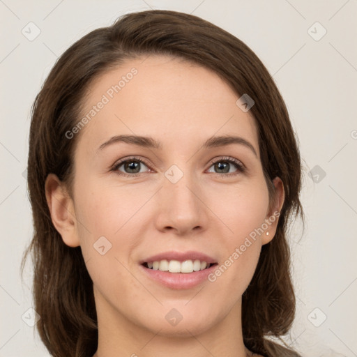 Joyful white young-adult female with medium  brown hair and grey eyes