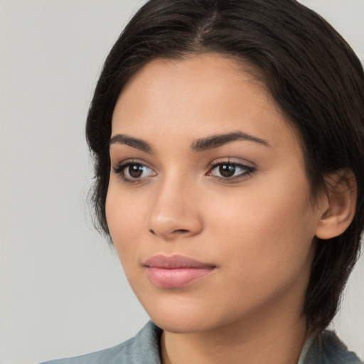 Neutral white young-adult female with medium  brown hair and brown eyes