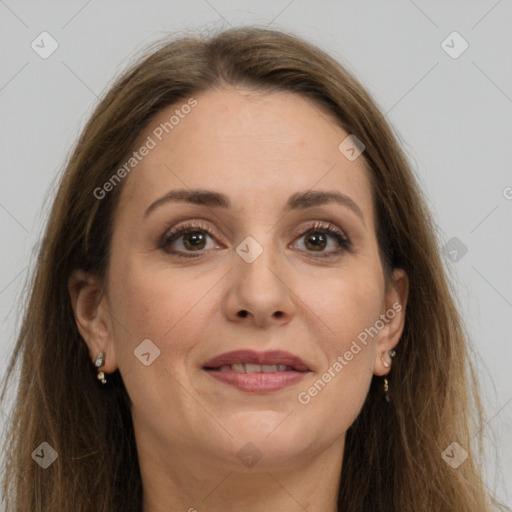 Joyful white adult female with long  brown hair and grey eyes