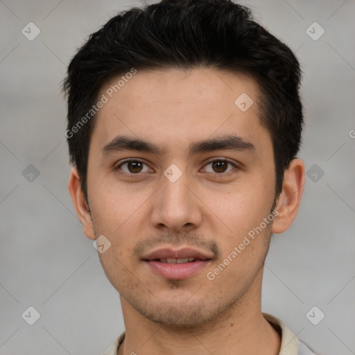 Joyful white young-adult male with short  black hair and brown eyes