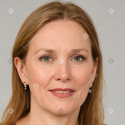 Joyful white adult female with long  brown hair and grey eyes