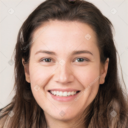 Joyful white young-adult female with long  brown hair and brown eyes