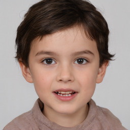 Joyful white child male with short  brown hair and brown eyes